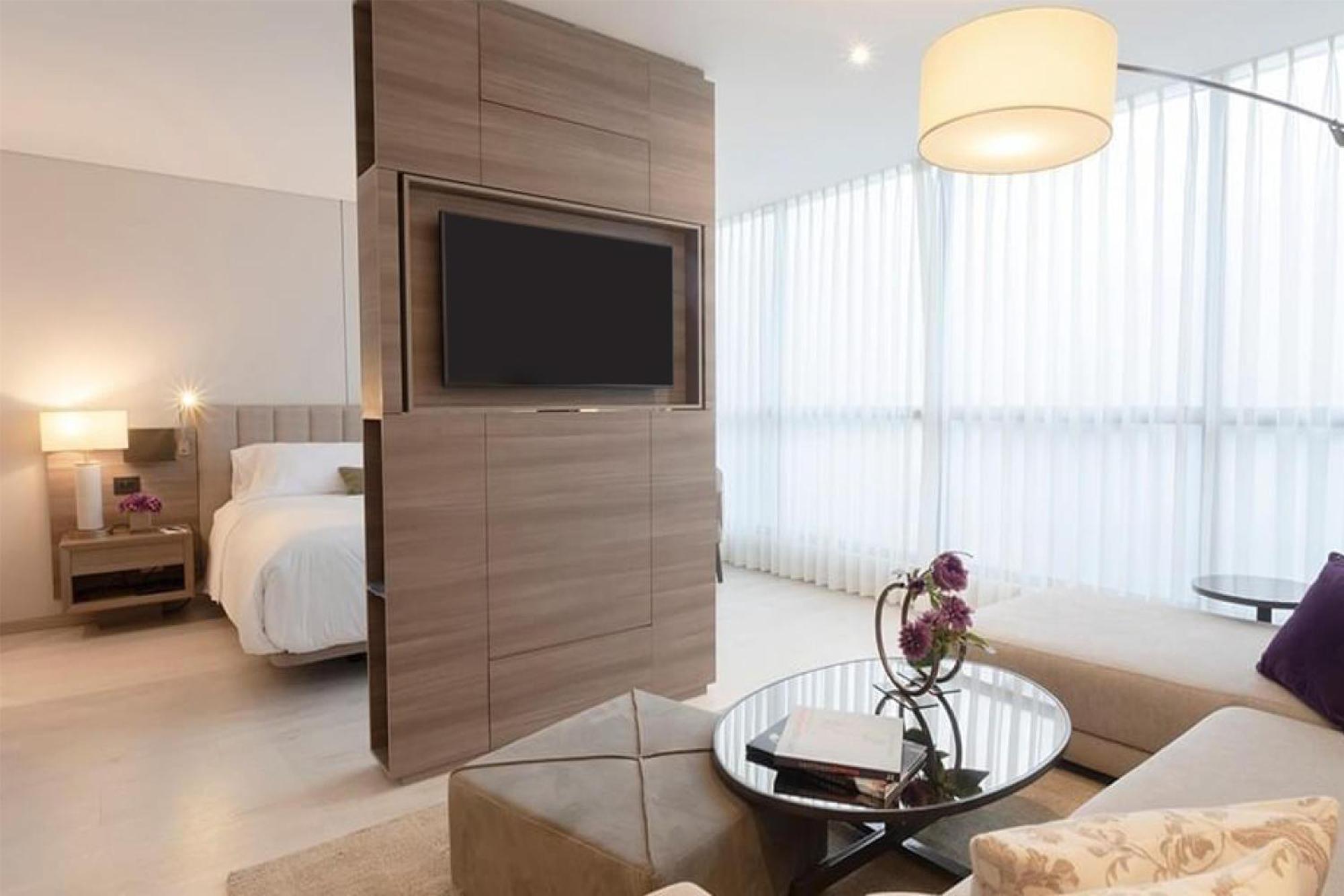 Suite Junior con cama extragrande, terraza y cocina